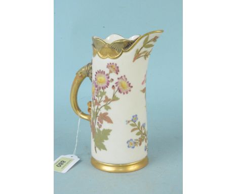 A Royal Worcester hand painted and gilded jug, pattern 1229, 19cm tall