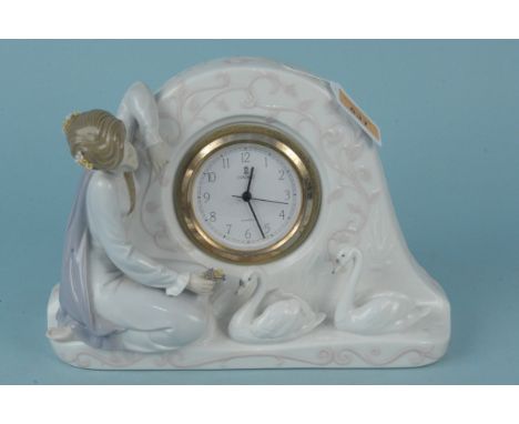 A 1990 Lladro mantel clock of a lady with swans, 25cm long (two minor petals missing)