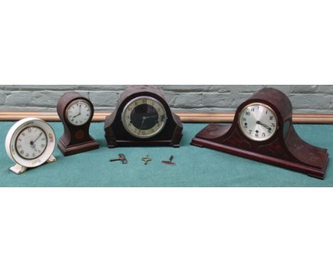 A German mantel clock, a ceramic Smiths clock, a waisted clock plus one other