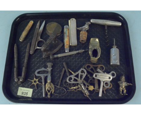 A mixed lot of items including a clock and watch, keys, penknives, travelling corkscrew, miniature oil can etc