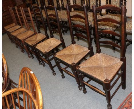 A set of four 19th century elm ladder back dining chairs together with another similar set of four (8)