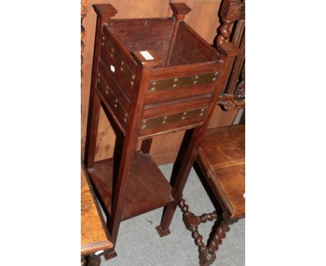An Arts &amp; Crafts walnut and cooper bound planter and a 19th century mahogany tripod table 