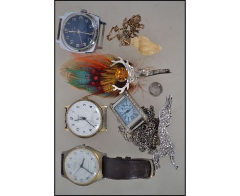 A collection of vintage watches to include Interpol, Sekonda, Ruhla, Sky etc together with Scottish feather brooh, shell on c