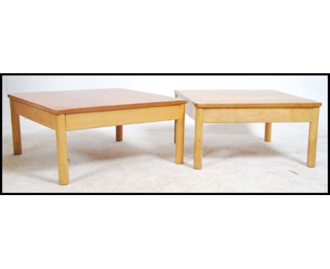 A near pair of 20th century Ercol beech and elm wood square coffee occasional table raised on turned legs with sqaured table 