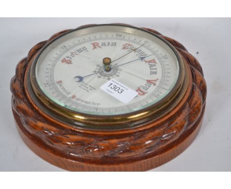 A &nbsp;1920's oak cased wall barometer having ceramic face with retailers notation for Kemp Bros Bristol. &nbsp;Glass af.&nb
