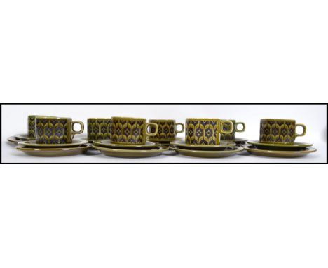 A group of 8 vintage retro mid century Hornsea pottery trios in the Heirloom pattern each trio having cup saucer and plate.&n
