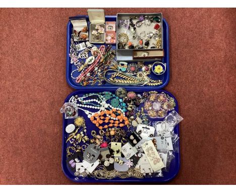 An Assortment of Costume Jewellery, to include kitsch style brooches, clip-on earrings, porcelain flower brooches, enamel nec