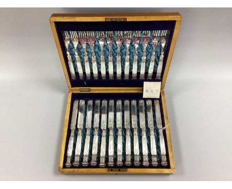 A Highly Decorative Set of Twelve Late XIX Century Mother of Pearl Handled Dessert Knives and Forks, with engraved scroll dec