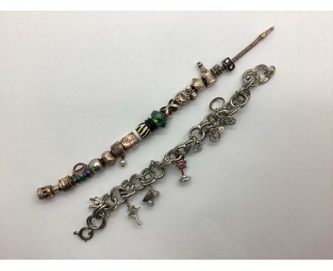 A Hallmarked Silver Truth Charm Bracelet, with a collection of charms including stamped "925", faceted glass bead, imitation 