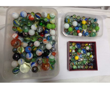 Two tubs and a box containing a quantity of vintage and later glass marbles