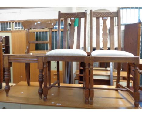 A pair of vintage oak framed high lathe back dining chairs - bearing retailer's labels for W. Brock &amp;Co., Torquay - sold 