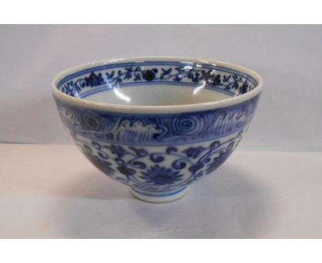 A small Chinese porcelain bowl with hand painted blue and central four character roundel seal