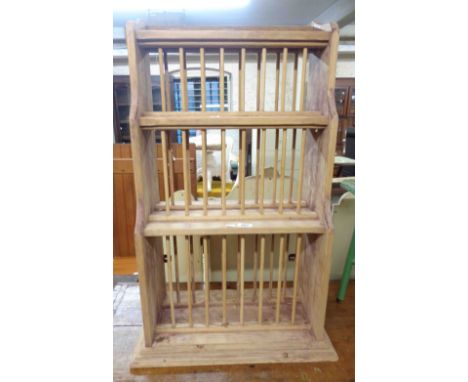 A 57.5cm vintage pine wall mounted waterfall plate rack with three tiers of stick dividers