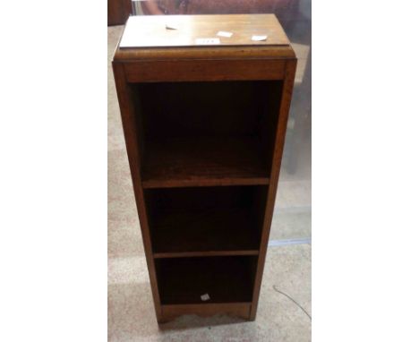 A vintage stained oak narrow three shelf open bookcase