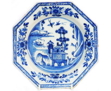 An 18th Century English Delftware plate of octagonal form with blue painted scenic decoration