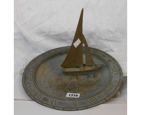 A vintage cast brass sundial with yacht pattern nomen and Tempus Fugit to rim