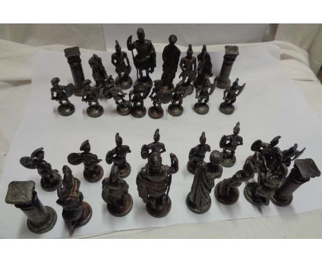 A vintage cast metal chess set of classical Roman form
