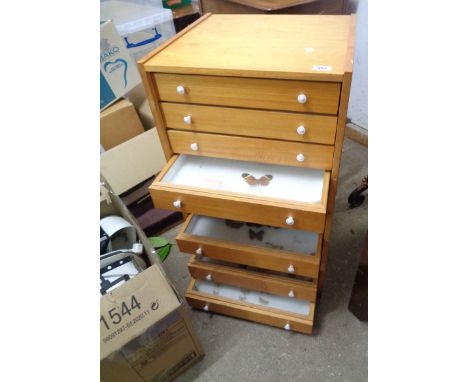 A vintage mixed wood ten drawer collector's chest containing a collection of assorted butterflies