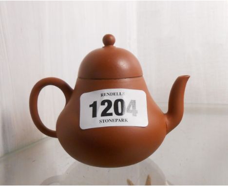 A miniature Chinese Yixing Zisha clay teapot