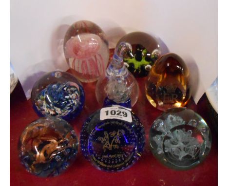 Eight glass paperweights including Caithness, etc.