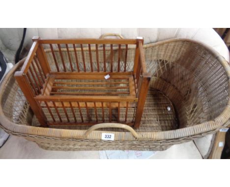 A large wicker Moses basket - sold with a vintage doll's cot