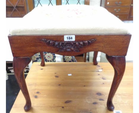 An antique style mahogany framed dressing stool with later tapestry upholstered seat panel, set on cabriole legs