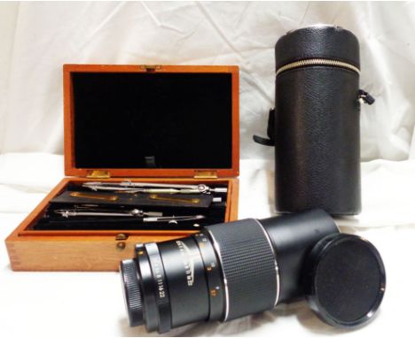 A vintage cased Pinsflex 200mm lens - sold with a wooden box containing a drawing set