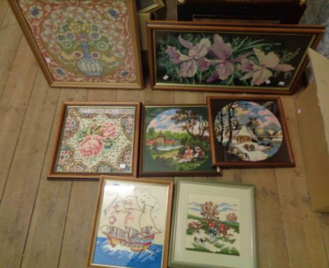 A box containing seven framed tapestry pictures - various subjects