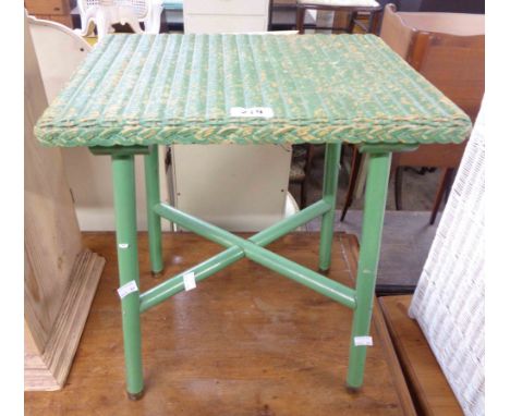 A vintage green painted occasional table with loom woven top and X-stretcher