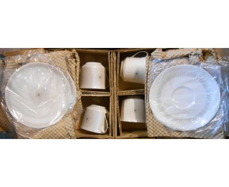 A vintage Royal Doulton twenty-one piece tea set in the Morning Star pattern in its original packing box