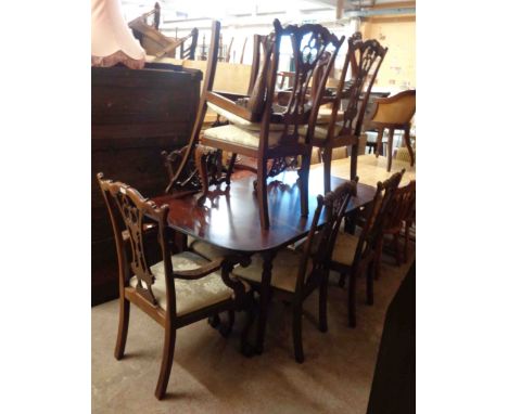 A set of eight 20th Century mahogany framed Chippendale style dining chairs with upholstered drop-in seats, set on carved cab