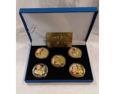 Three cased gold plated coin sets comprising Marylyn Monroe, R.A.F. and vintage cars - all with certificates