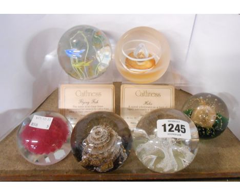 Two Caithness glass limited edition paperweights with stands - sold with two other Caithness paperweights, a Selkirk example 