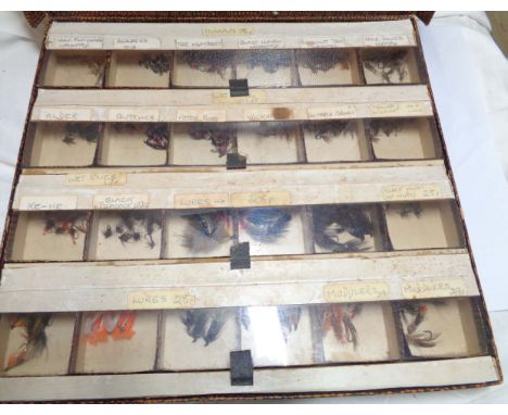 A case containing a quantity of vintage Eddy Kubling fishing flies