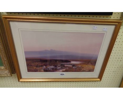 A gilt framed coloured print, depicting a view on Dartmoor with clapper bridge and stream in foreground