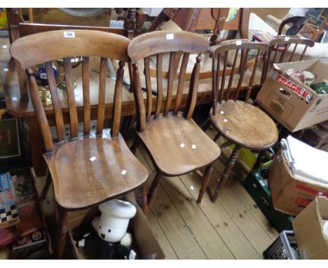 A pair of antique mixed wood lathe back standard chairs, with moulded solid elm seats bearing W.E. stamps, sold with two stic