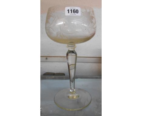 A large vintage glass vase of goblet form with engraved floral decoration