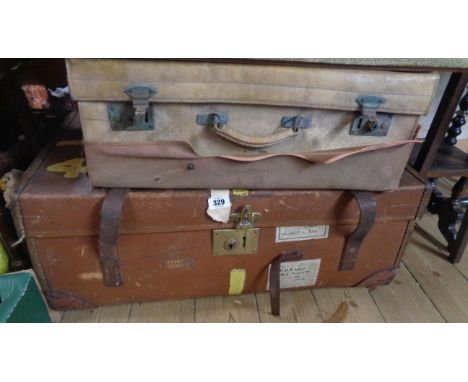 A vintage canvas travelling trunk with leather strap handles - sold with a vintage leather suitcase - various condition