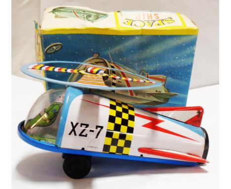 A vintage A.T.C. Japanese tin-plate spaceship toy in original box