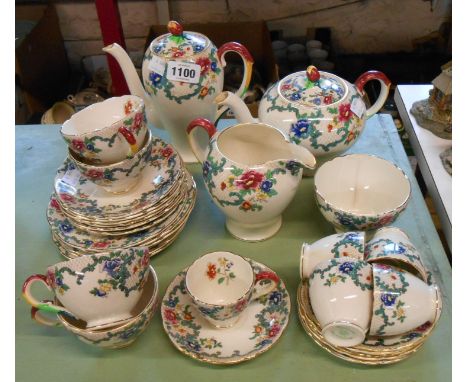 A quantity of Royal Cauldon pottery teaware decorated in the Victoria pattern including teapot, coffee pot, cups and saucers,