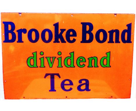 An original 'Brooke Bond Dividend Tea' enamel advertising sign with blue and green lettering on an orange ground