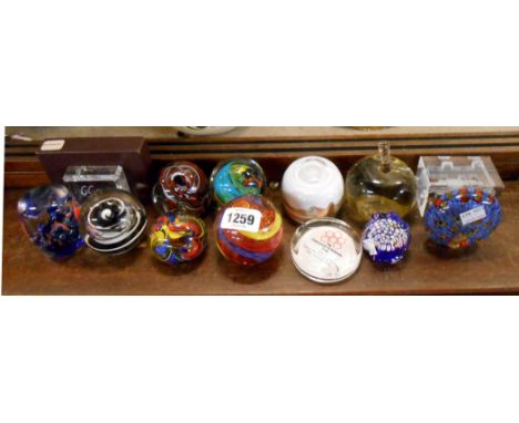 A quantity of assorted glass paperweights including Caithness and other examples