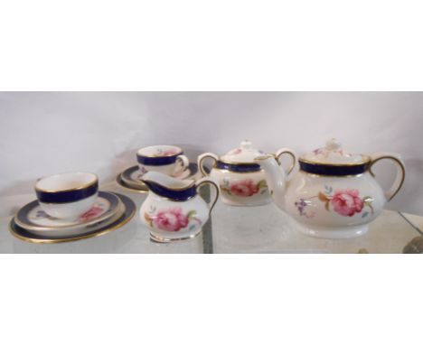 A Coalport miniature tea set comprising teapot with floral decoration, sucrier, milk jug and two trios