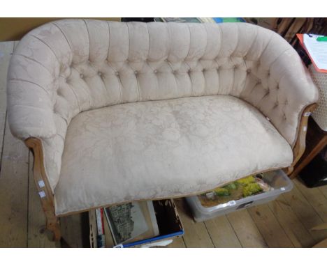 A 1.28m Edwardian mahogany part show frame 'love seat' with button back machine tapestry upholstery, set on cabriole legs wit