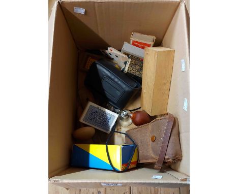 A box containing a quantity of collectable items including bone dominoes in slide top wooden box, playing cards, etc.