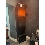 Upcycled Grandfather clock lamp with orange LED bulb, by artist Tanya Tier