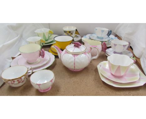 An Aynsley butterfly wing part tea set including a teapot, cups and saucers, three Shelley trios etc CONDITION REPORT: The Ay