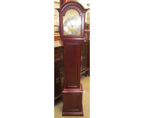 A Schmeckenbecker modern grandmother clock with a silvered chapter ring and Roman numerals