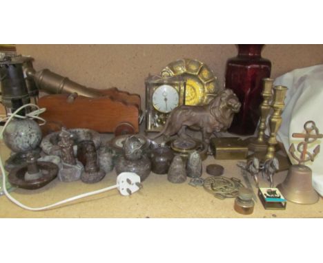 A Kundo anniversary clock together with a brass dish, brass lion, brass candlesticks, other brass wares, model canon, miners 