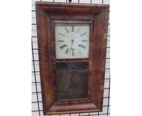 A 19th century walnut cased American wall clock, the square dial with Roman numerals